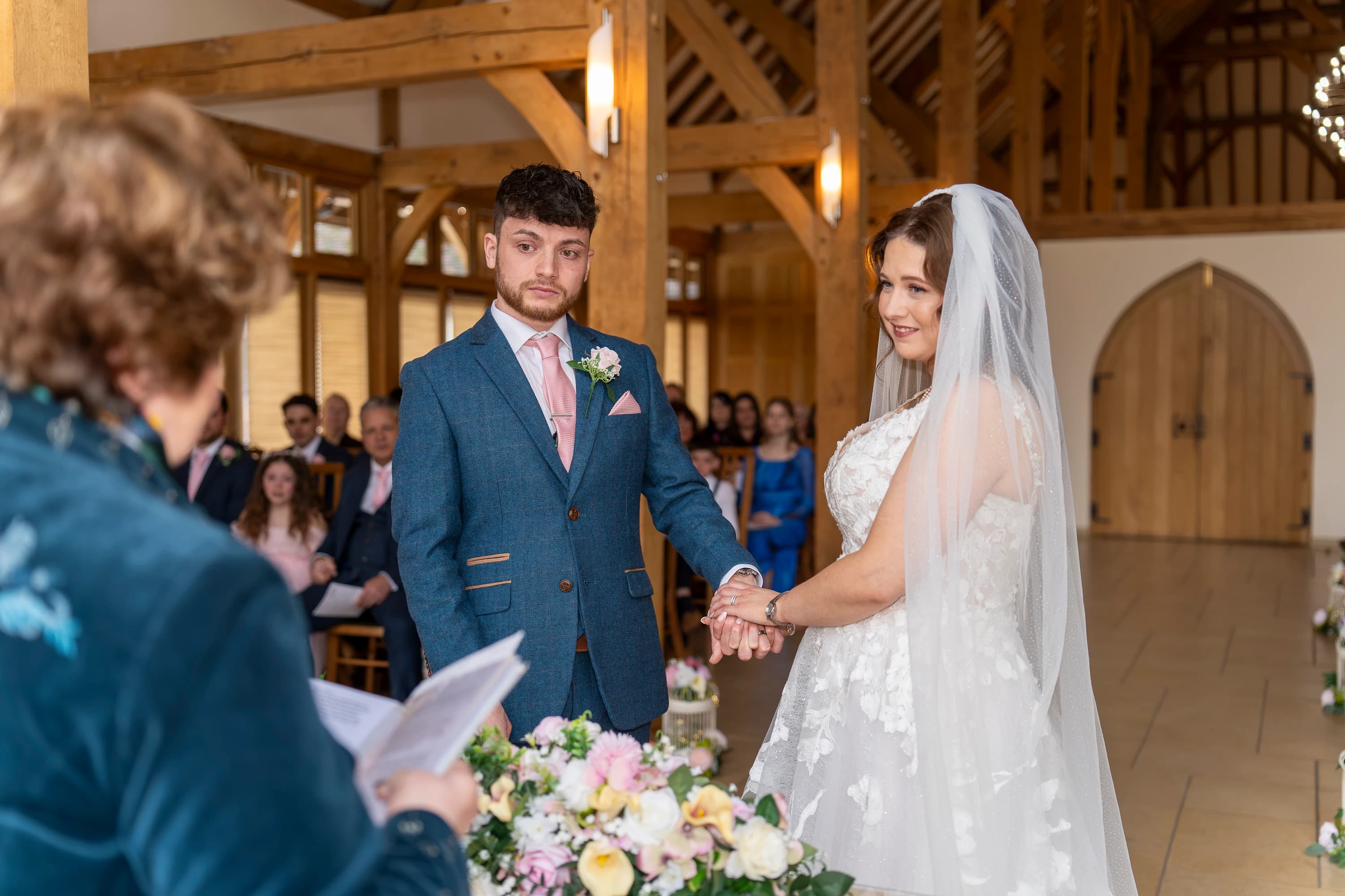 Charlie and Luke sharing a close wedding ceremony moment