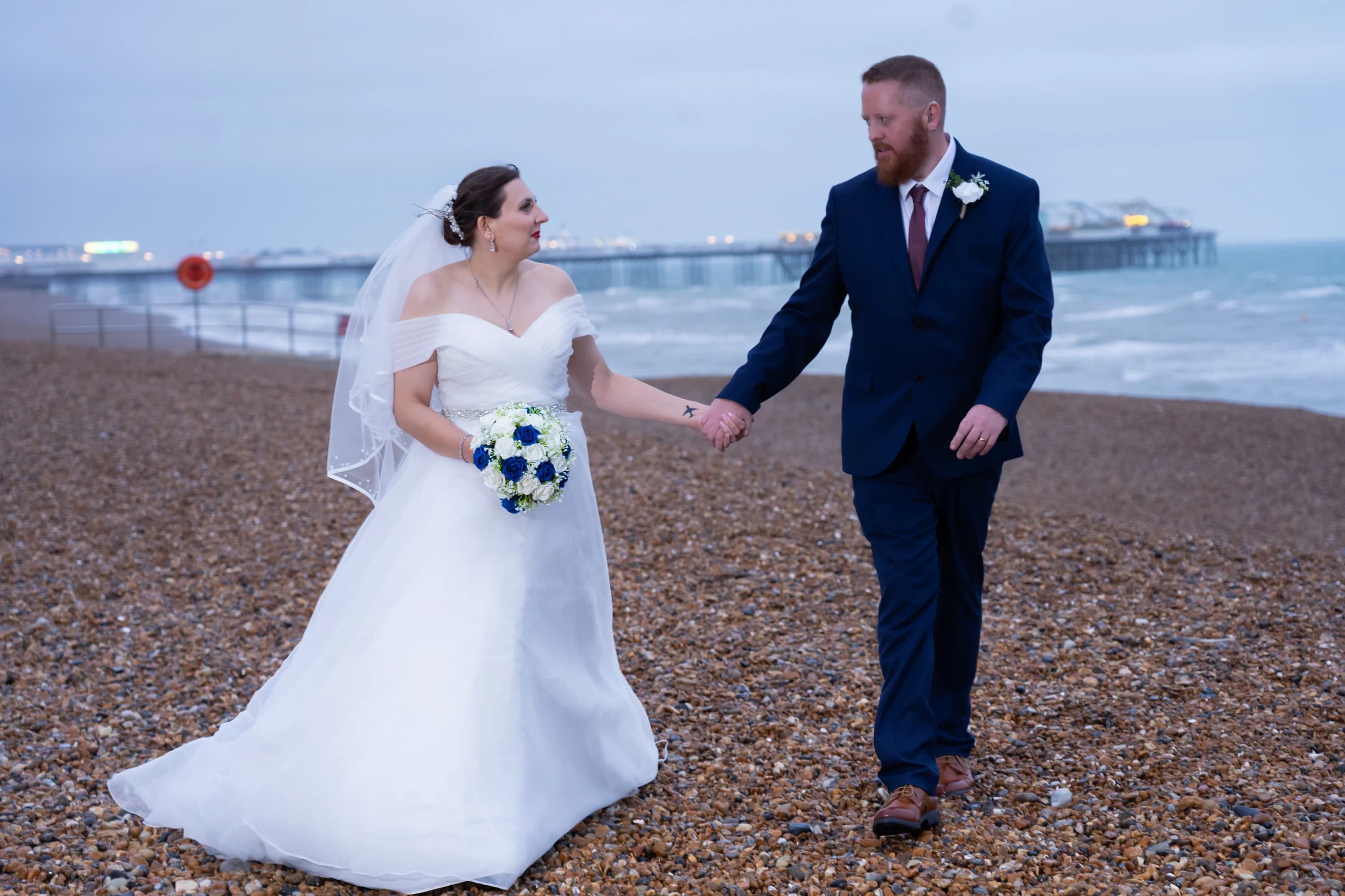 Ineta and Steve walking together along the beach