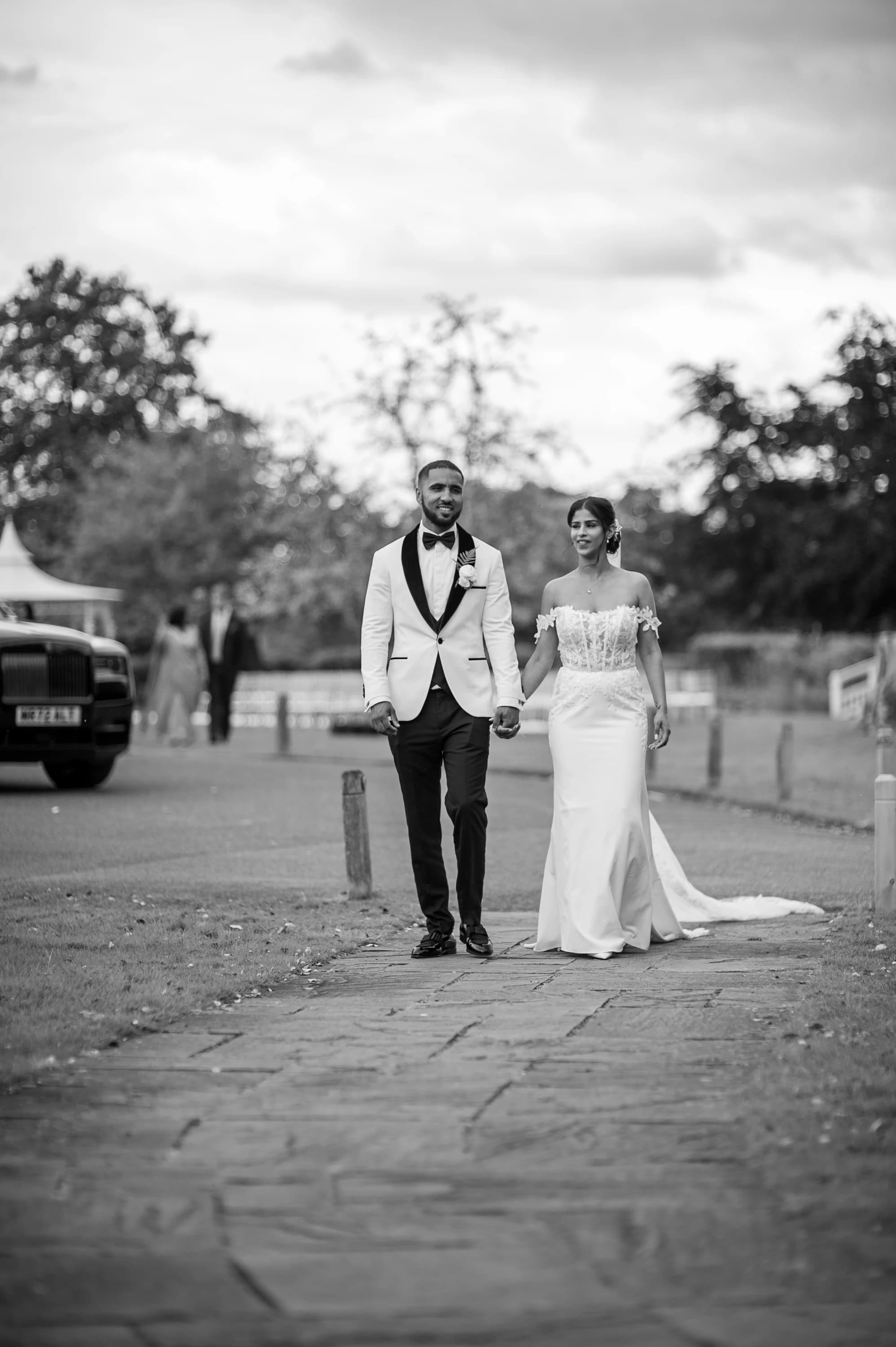 Rohini and Micheal walking together in black and white
