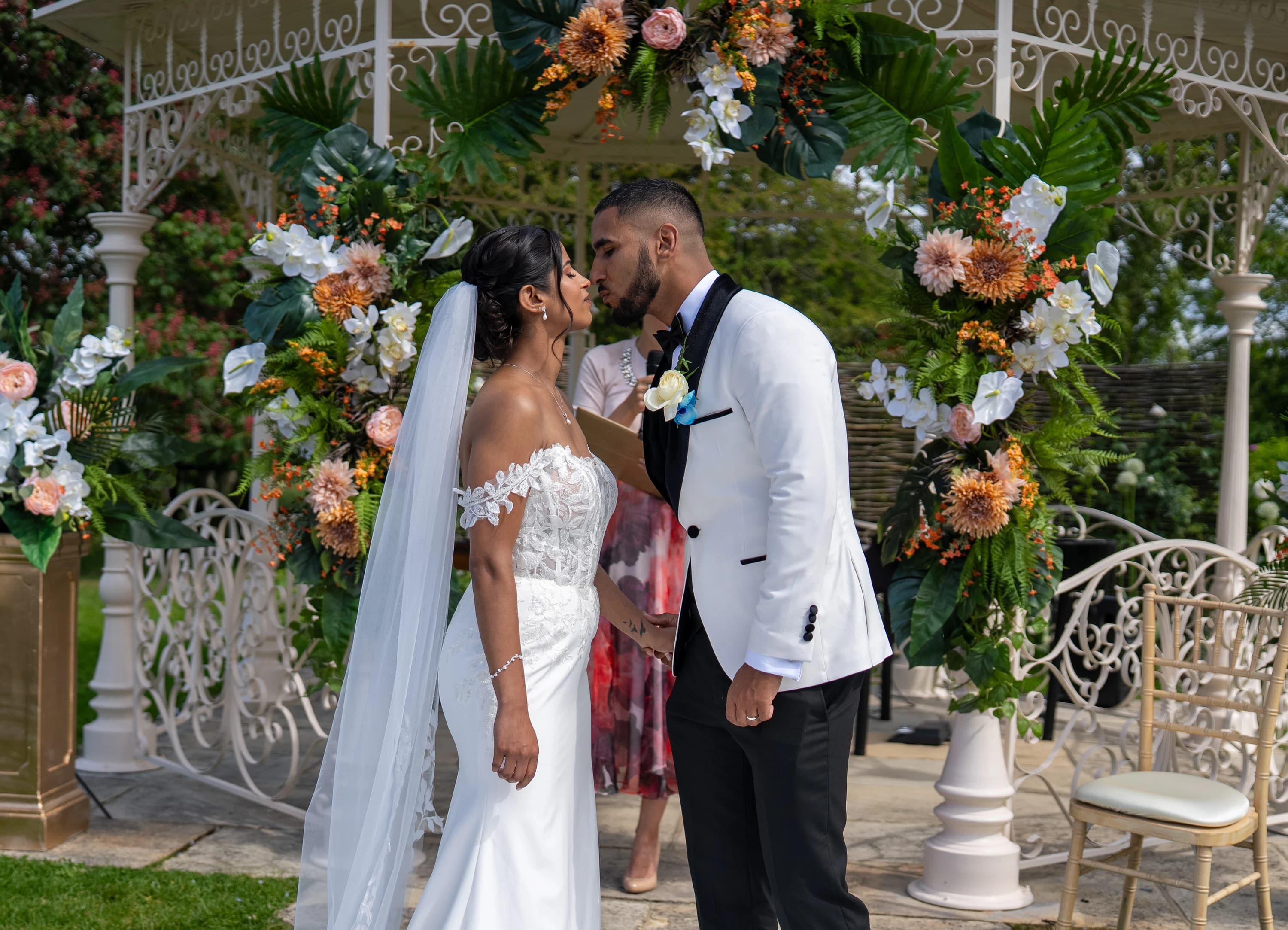 Rohini and Micheal sharing their ceremony kiss
